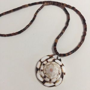 Brown and cream shell colored swirl mermaid necklace
